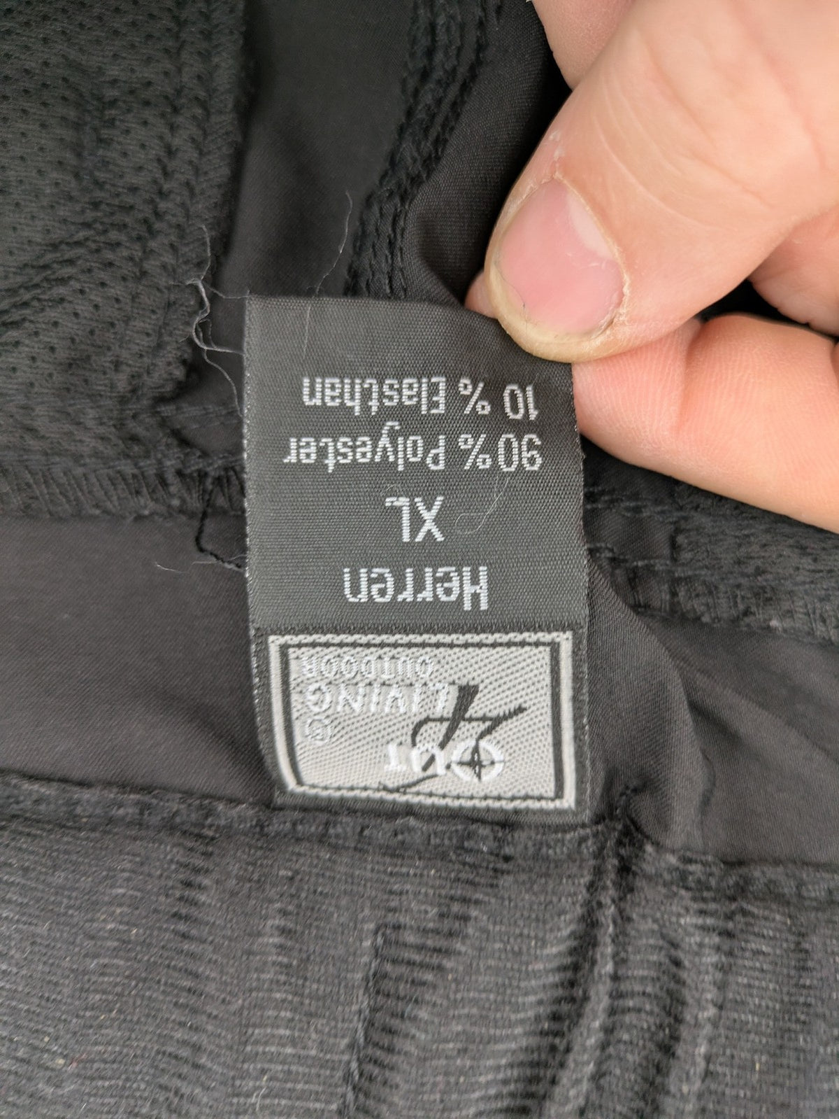 Outdoor grey trekking pants with zippered cargo pockets and durable stretch fabric.
