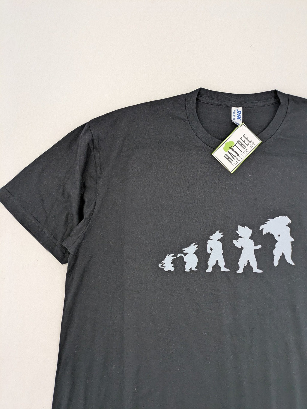Dragon Ball Z blue and grey t-shirt featuring Son Goku evolution graphic, 100% cotton.