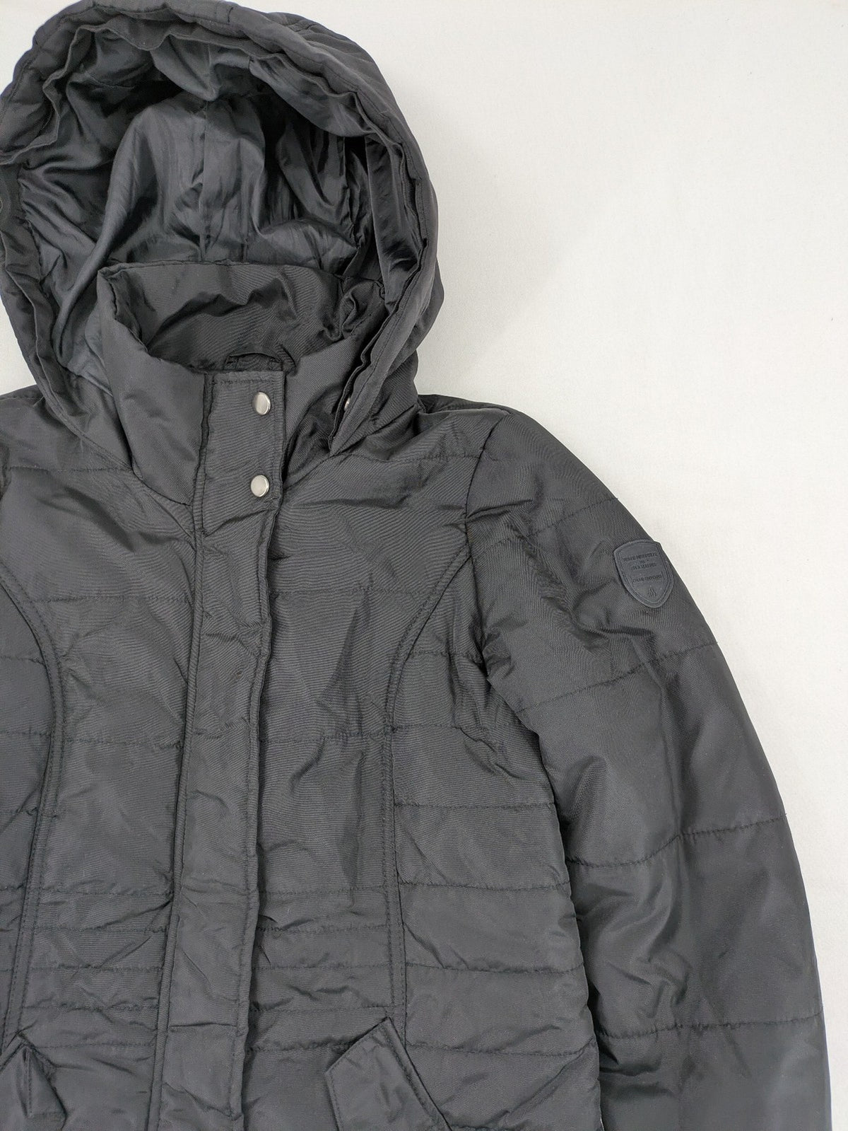 Vero Moda black quilted jacket with hood, reflective stripes, nylon material.