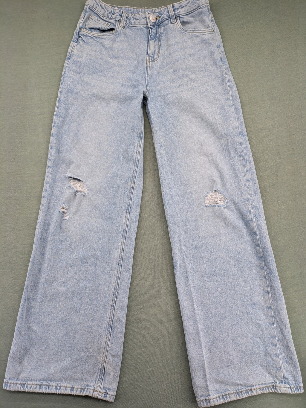 C&A blue wide leg jeans with distressed knee details and classic five-pocket design.