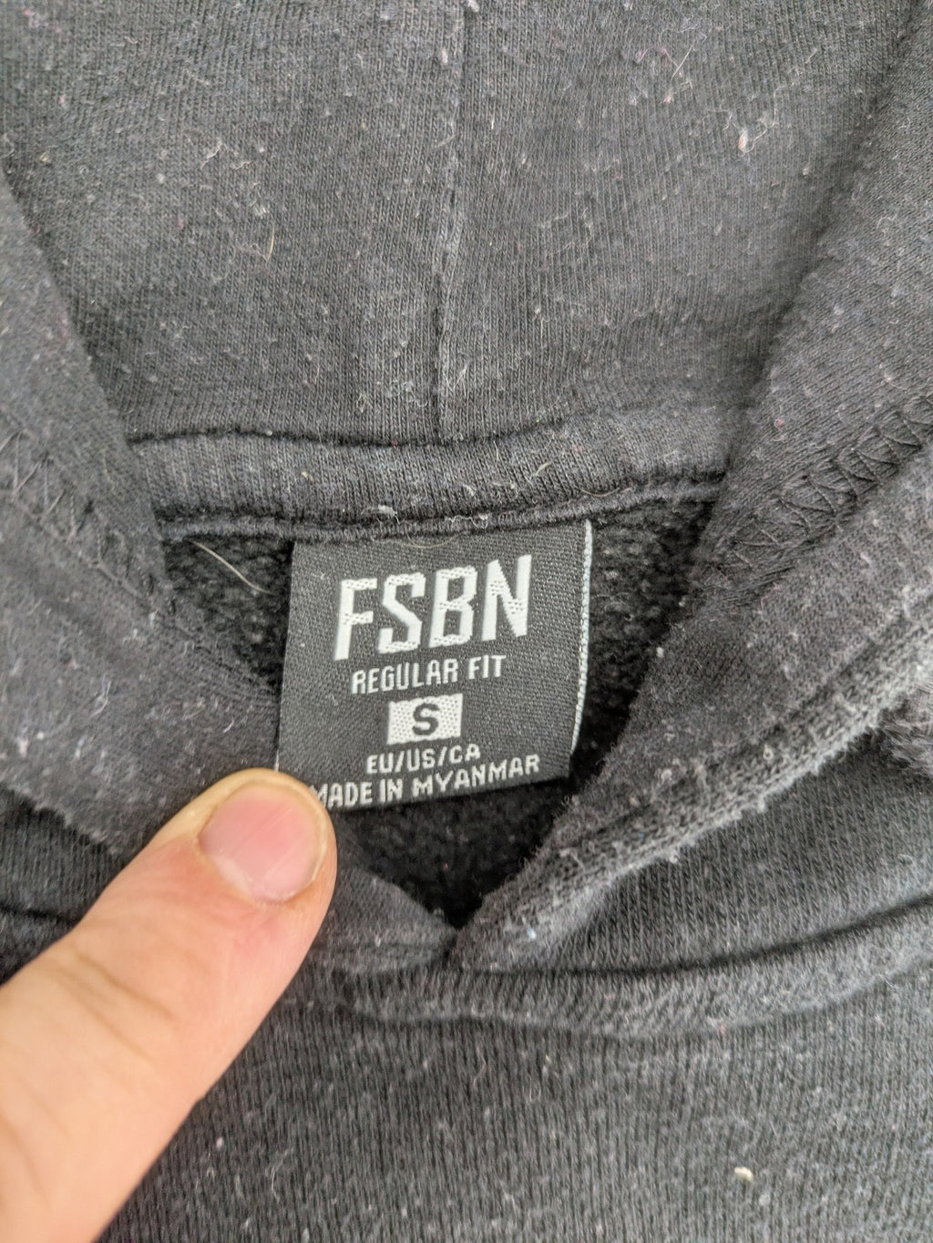 FSBN white zip-through hoodie with "Just Do Nothing" graphic and adjustable drawstring hood.