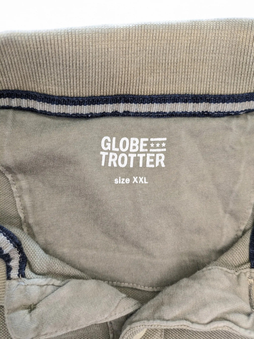 Globe-Trotter beige khaki polo shirt with classic collar and small chest logo.