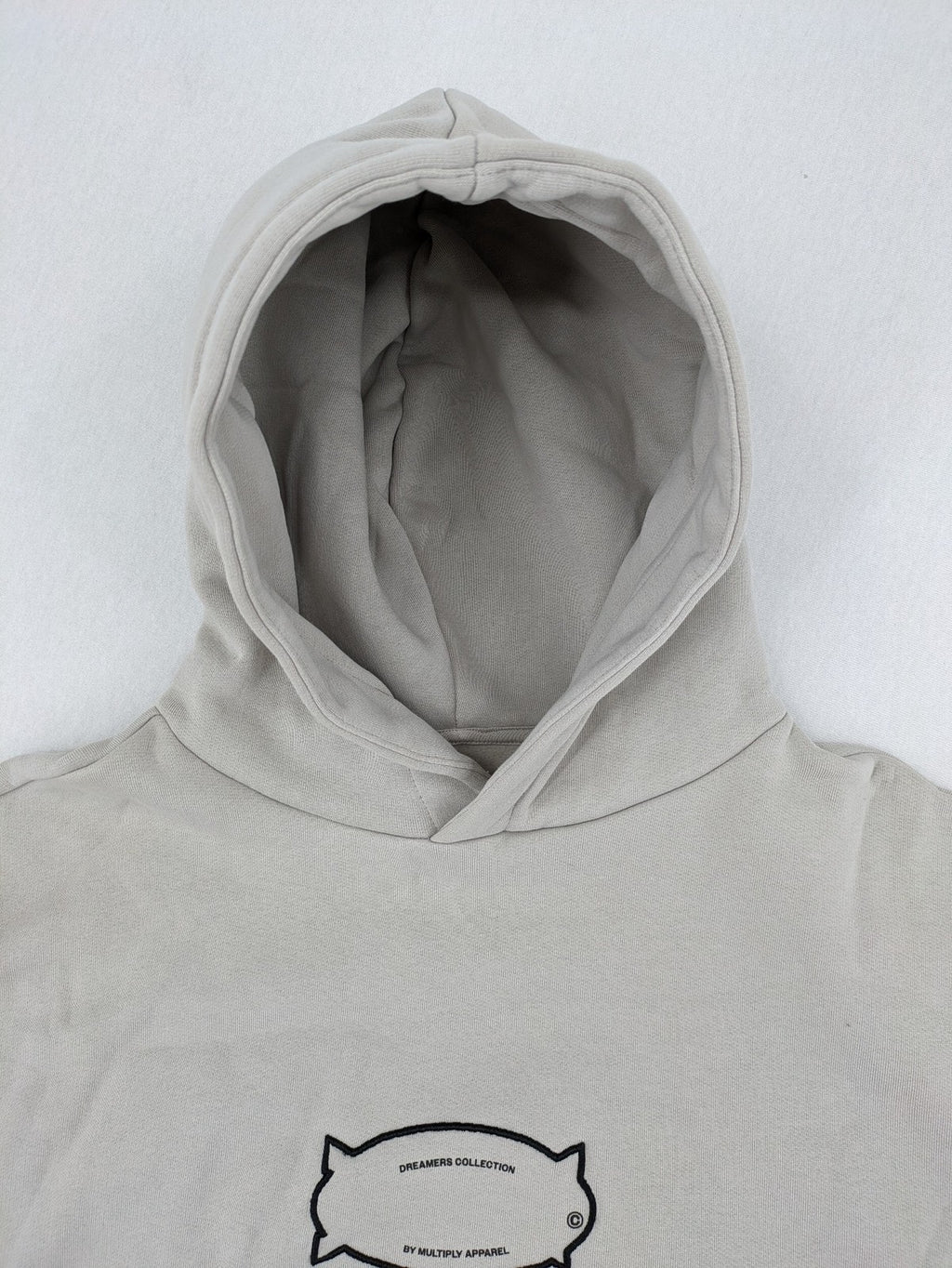 Multiply grey zip-through hoodie with embroidered logo and large "MLTPLY" print on back.