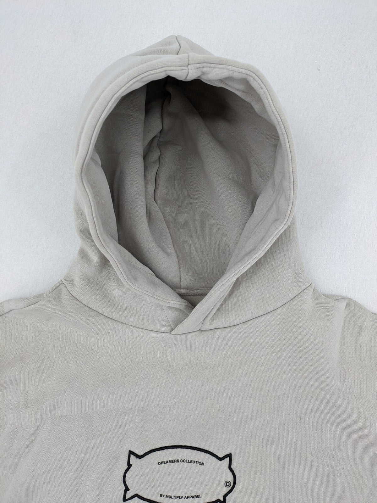 Multiply grey zip-through hoodie with embroidered logo and large "MLTPLY" print on back.