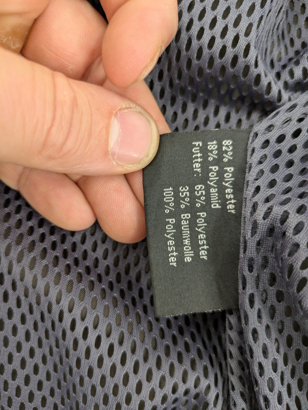 Barisal grey coat with hood, cargo pockets, and checkered lining detail.