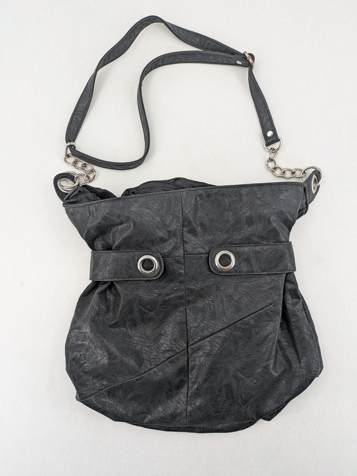 New Yorker black hobo handbag with silver chain details and large eyelets.