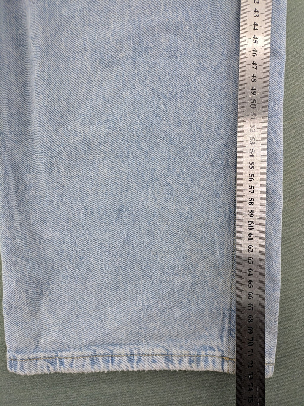 C&A blue wide leg jeans with distressed knee details and classic five-pocket design.