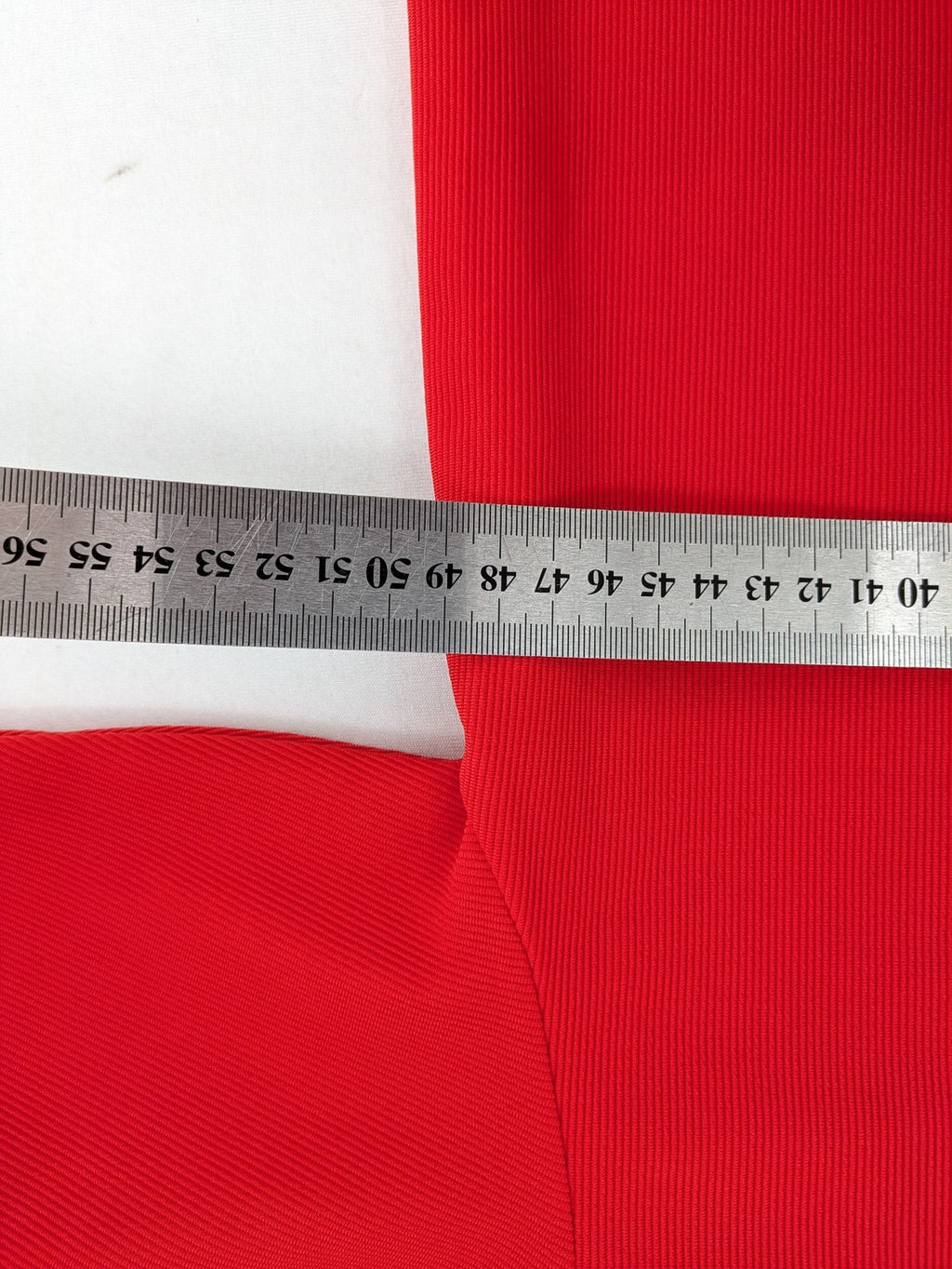 Hajo red t-shirt with ribbed texture and rhinestone Y-logo on chest.