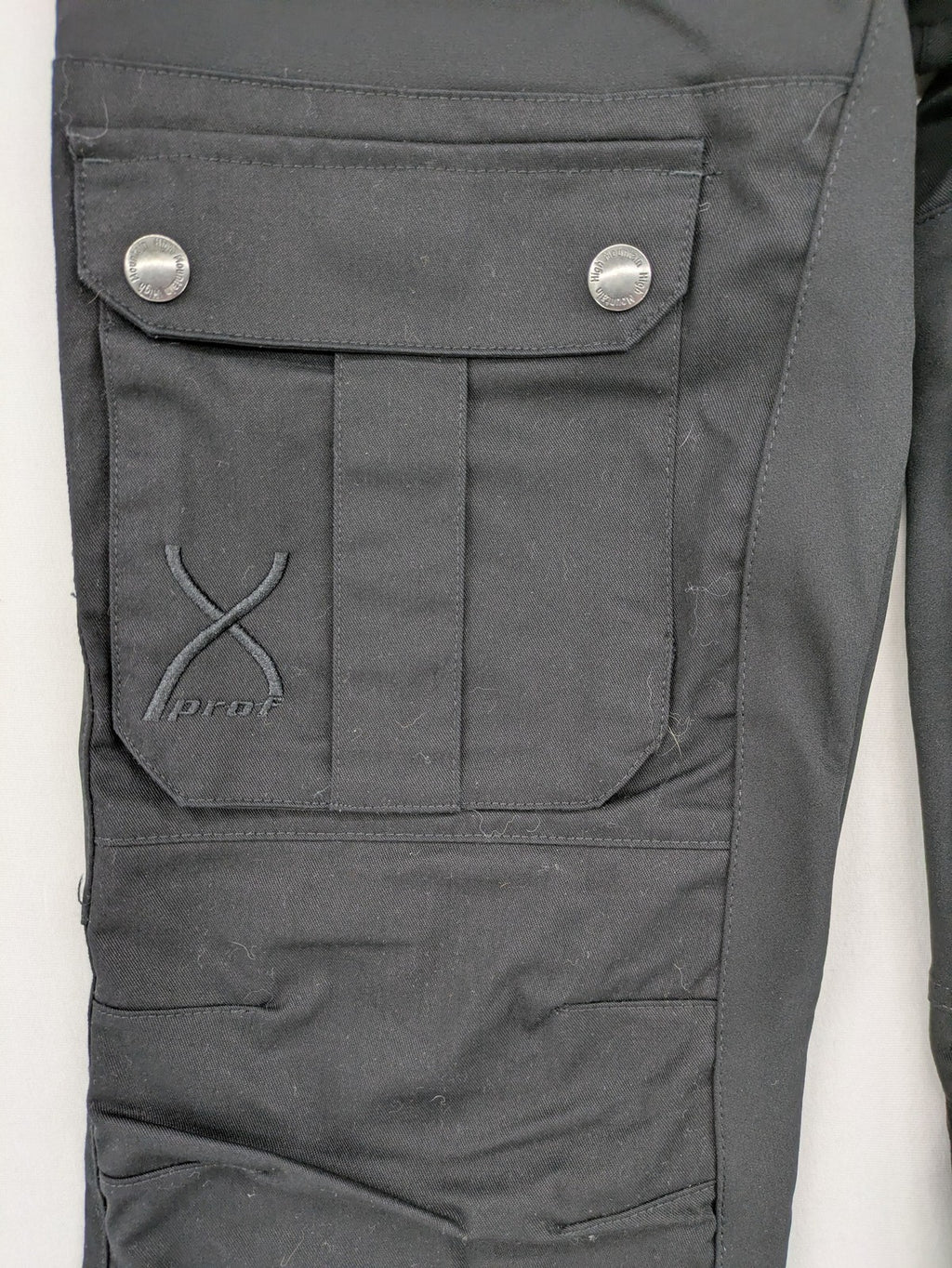 High Mountain black cargo pants with multiple pockets and durable stretch material.