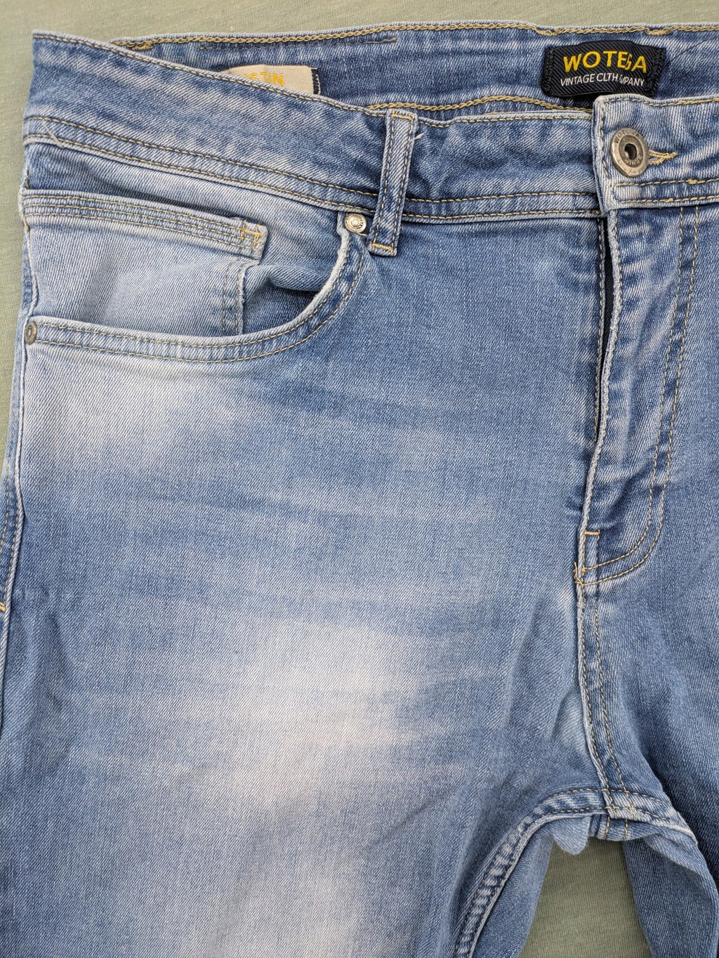 Wotega blue straight jeans light wash faded with classic 5-pocket design and stretch material.