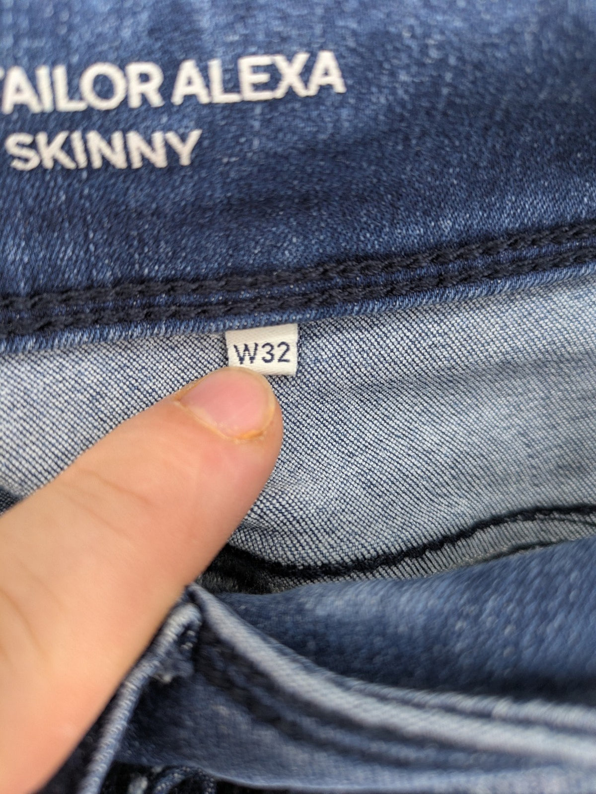 Tom Tailor blue skinny jeans with classic 5-pocket design and double button closure.