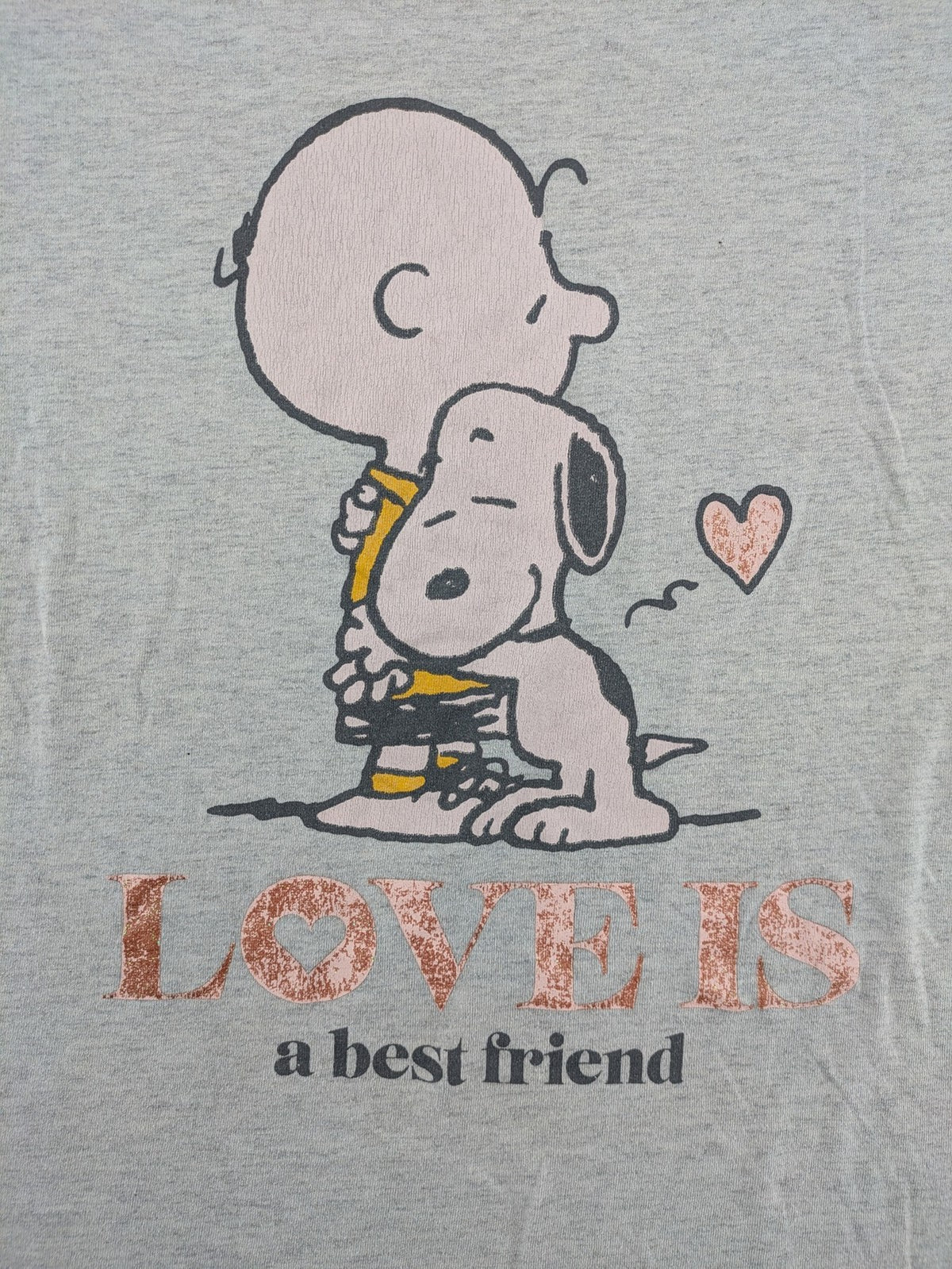 Peanuts brown vintage top with Snoopy and Charlie Brown illustration, rose gold text.