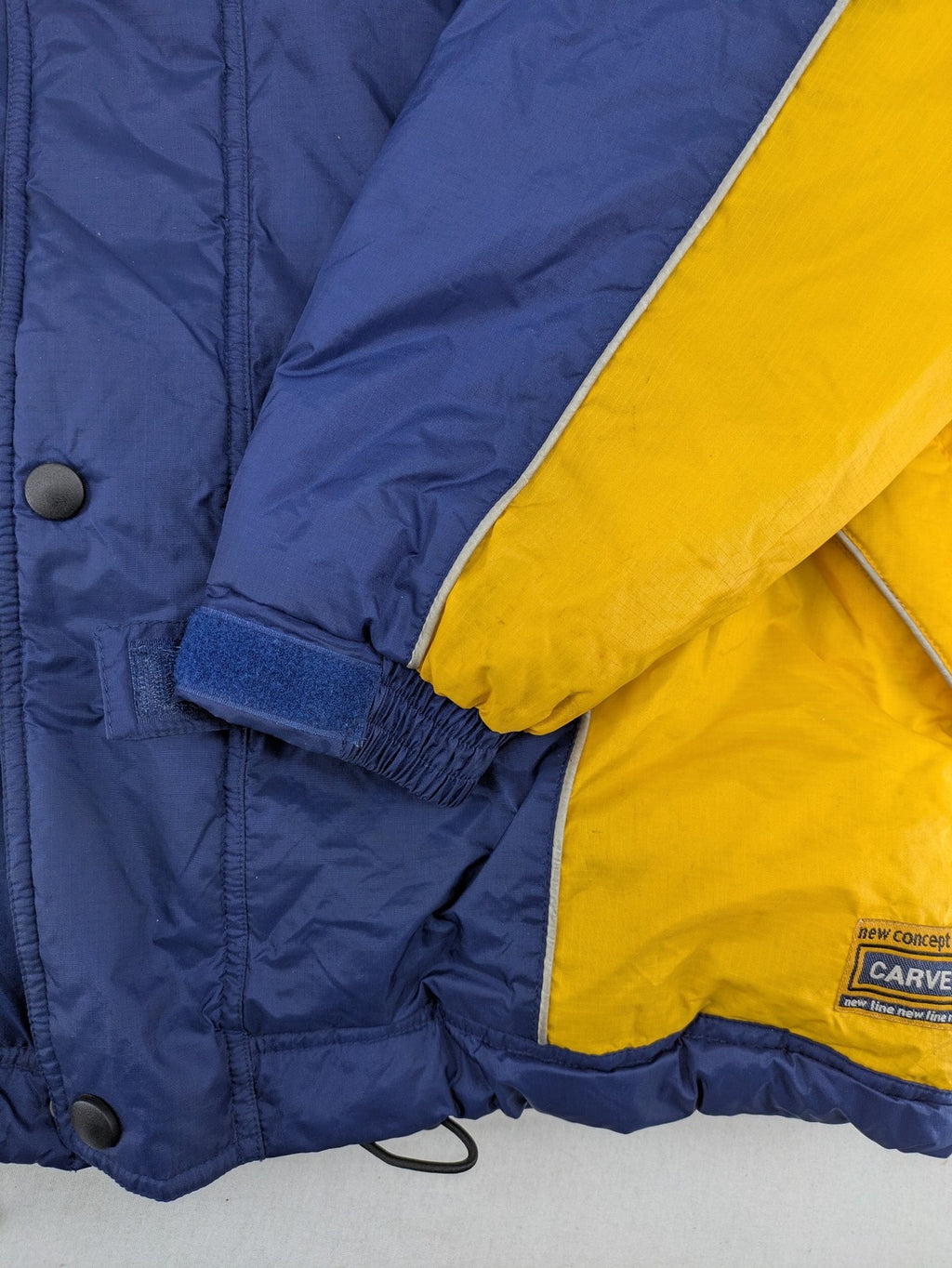 Shamp navy and yellow vintage ski jacket and pants set with retro design.