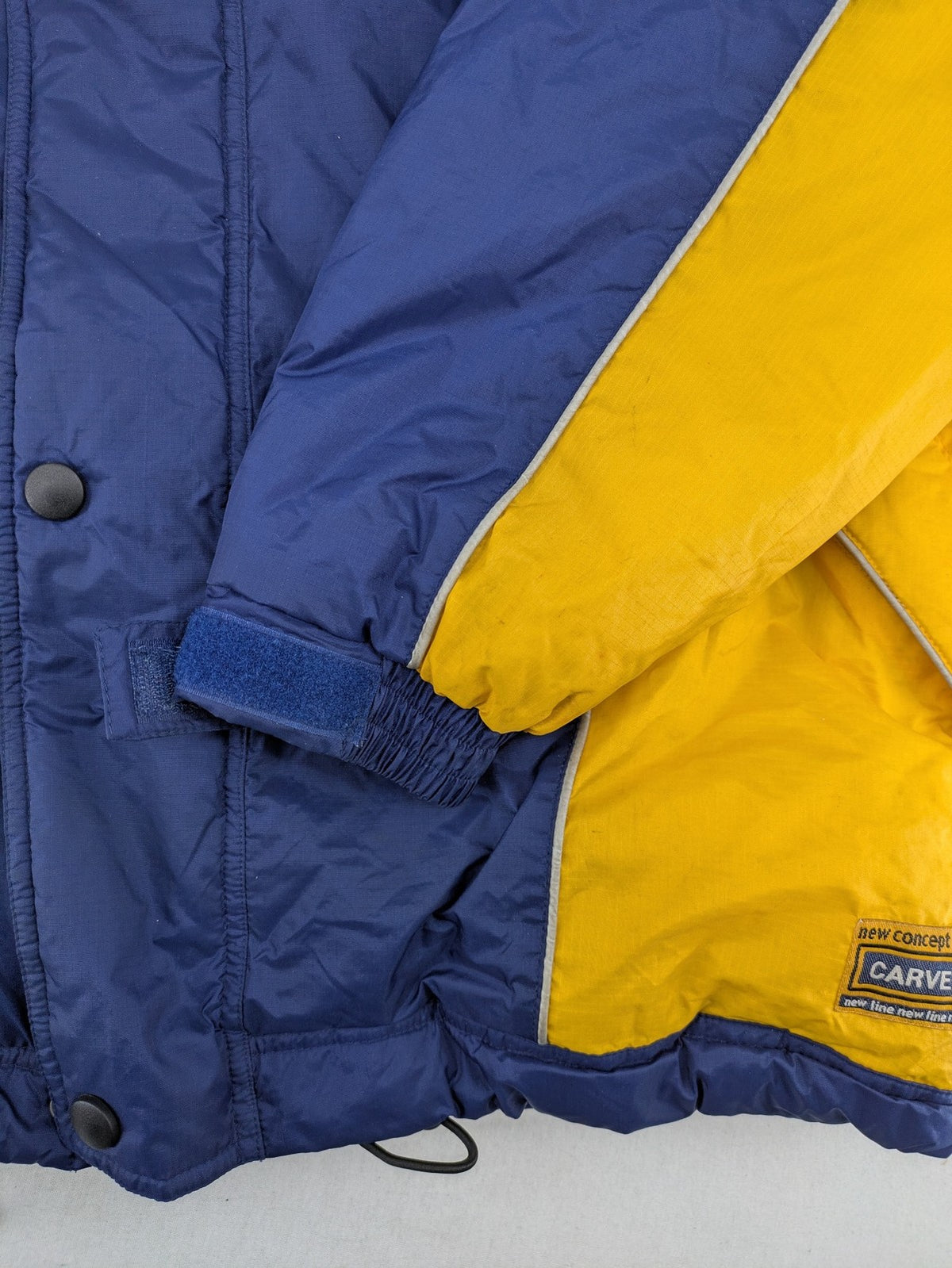 Shamp navy and yellow vintage ski jacket and pants set with retro design.