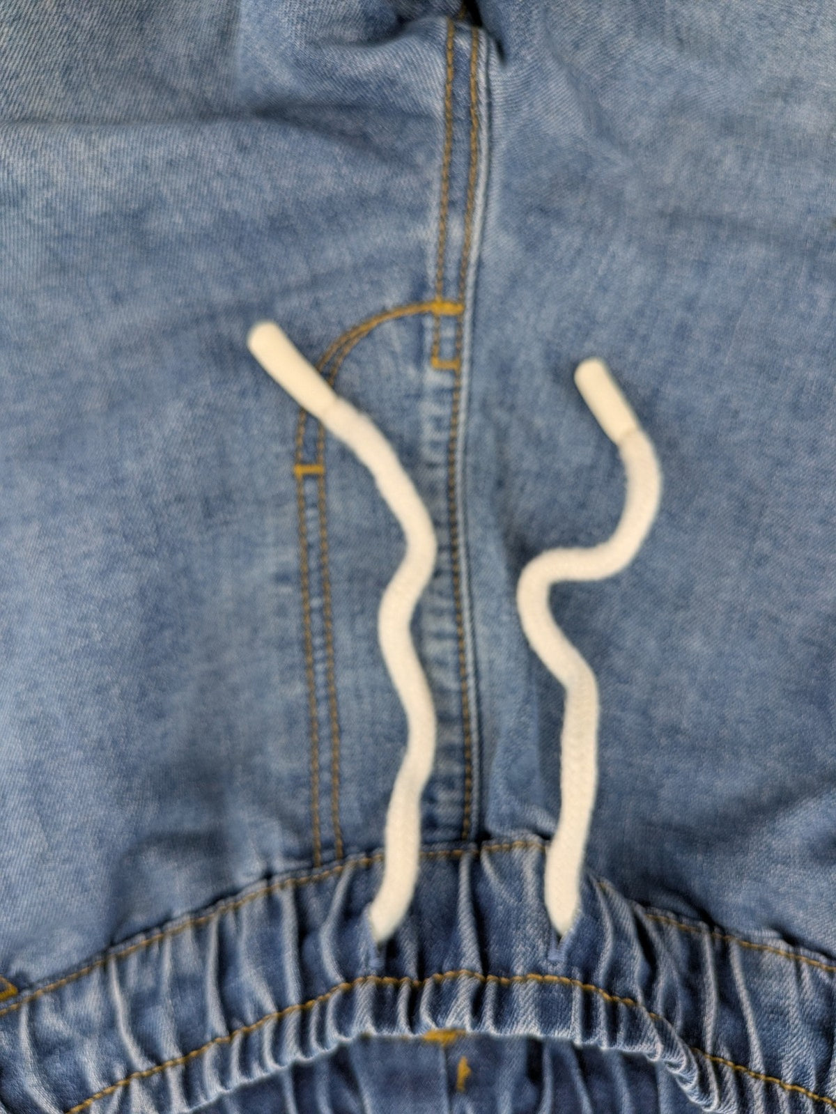 C&A blue denim shorts with elastic waistband and decorative drawstring, classic style.