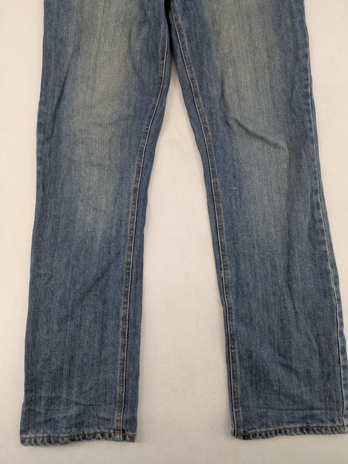 Cheap Monday blue straight jeans with button fly and classic medium wash finish.