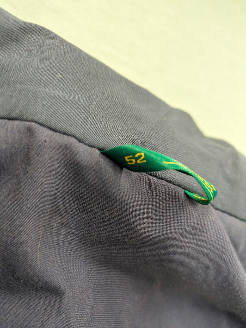 Canda green parka coat with dark lining, multiple pockets, and Micro Membrane technology.