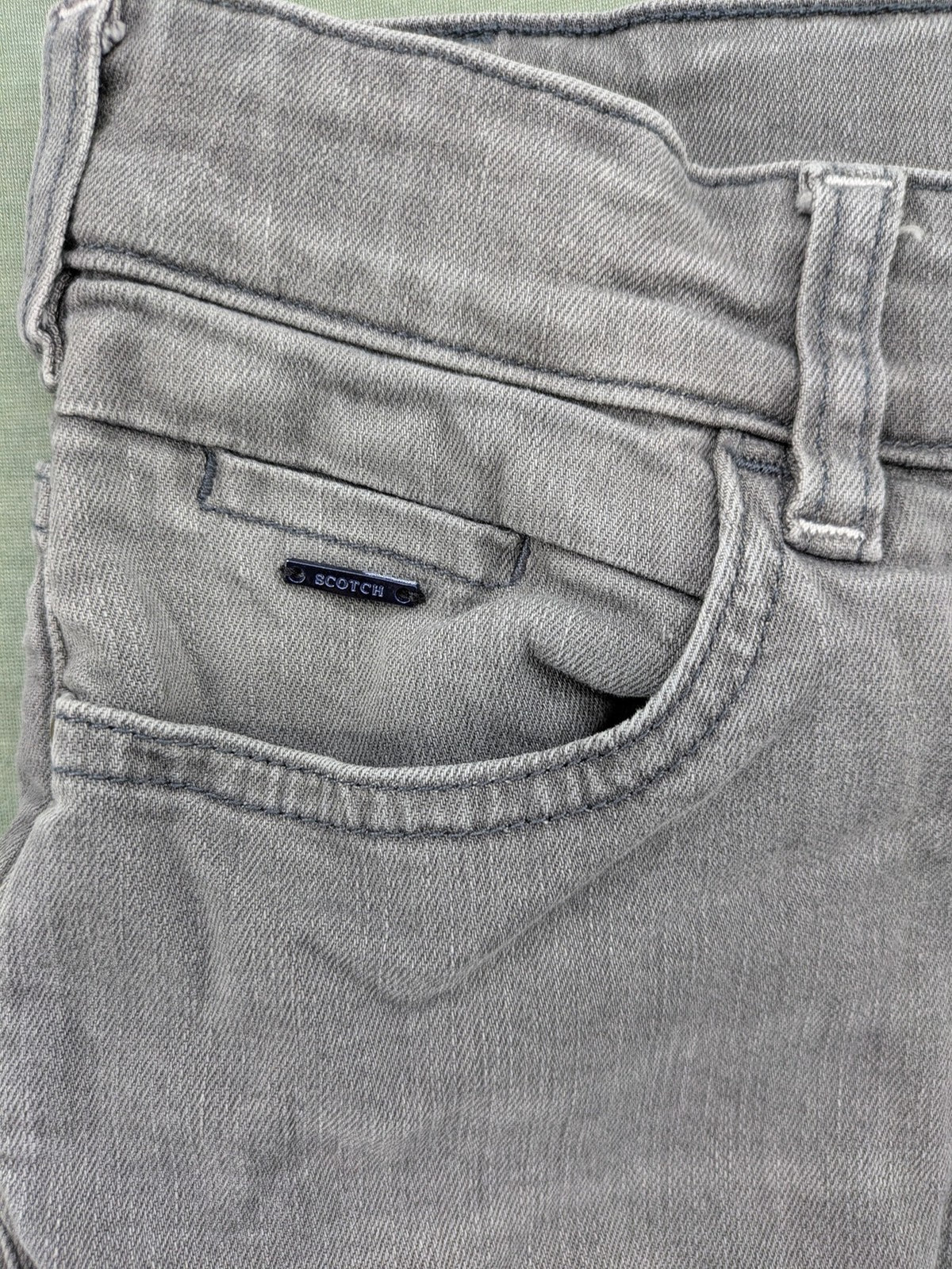 Scotch & Soda grey straight jeans with classic five-pocket design and logo patch.