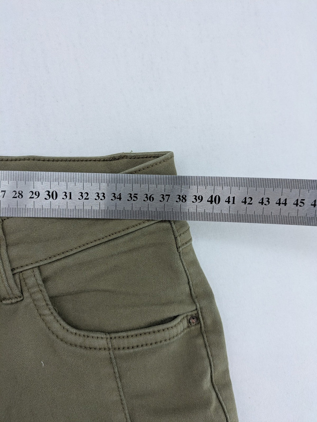 Clockhouse green moto jeggings with ribbed knee panels and ankle zippers.