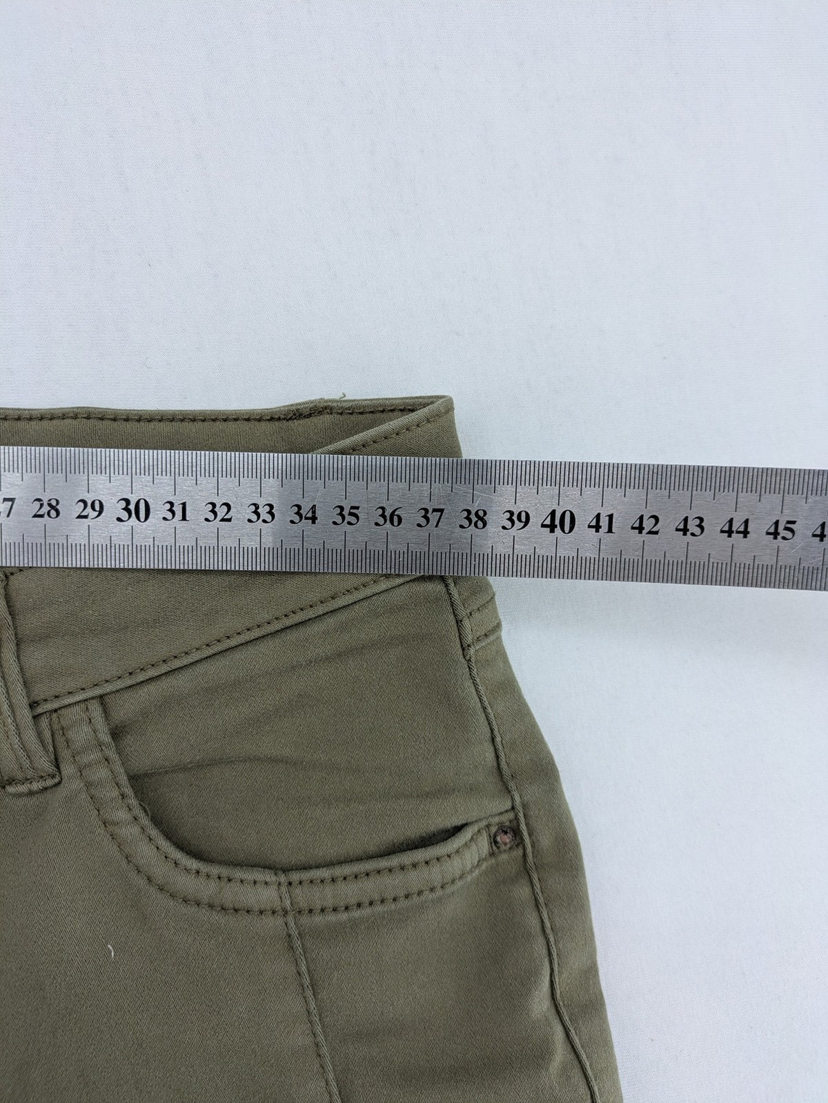 Clockhouse green moto jeggings with ribbed knee panels and ankle zippers.