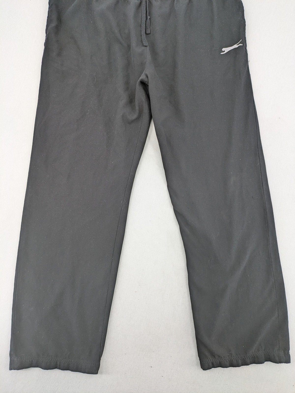 Slazenger grey loungewear joggers with adjustable drawstring and subtle logo on thigh.