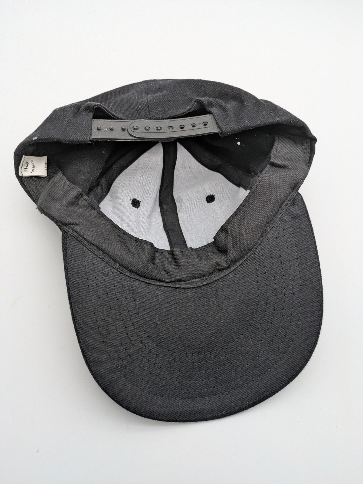 Quantum black snapback cap with bright blue embroidered logo and adjustable snapback closure.
