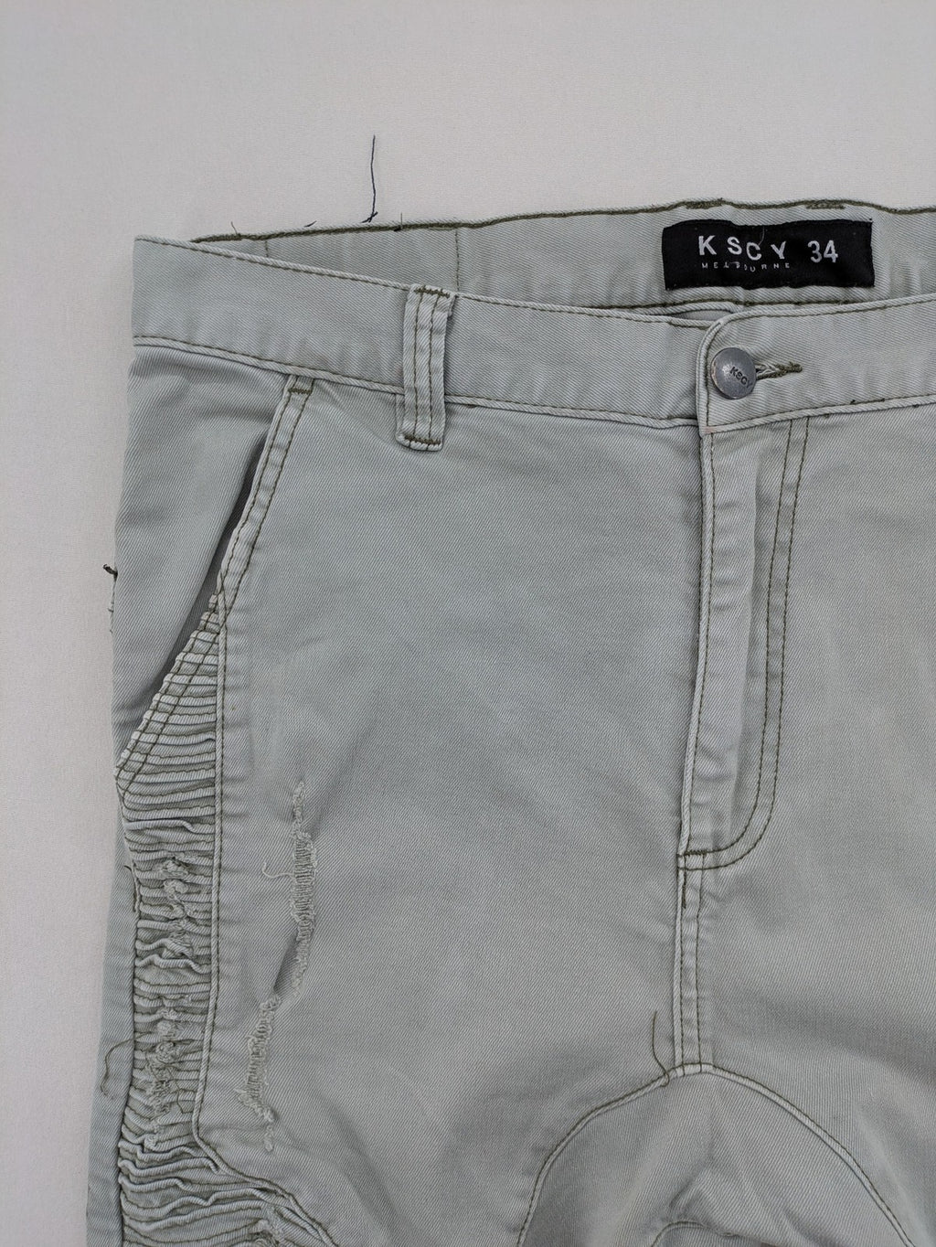 KSCY grey straight jeans with distressed details and ribbed biker inserts.