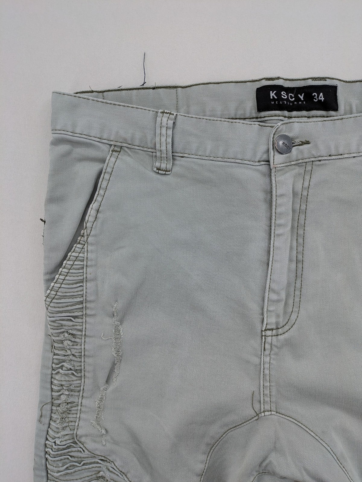 KSCY grey straight jeans with distressed details and ribbed biker inserts.