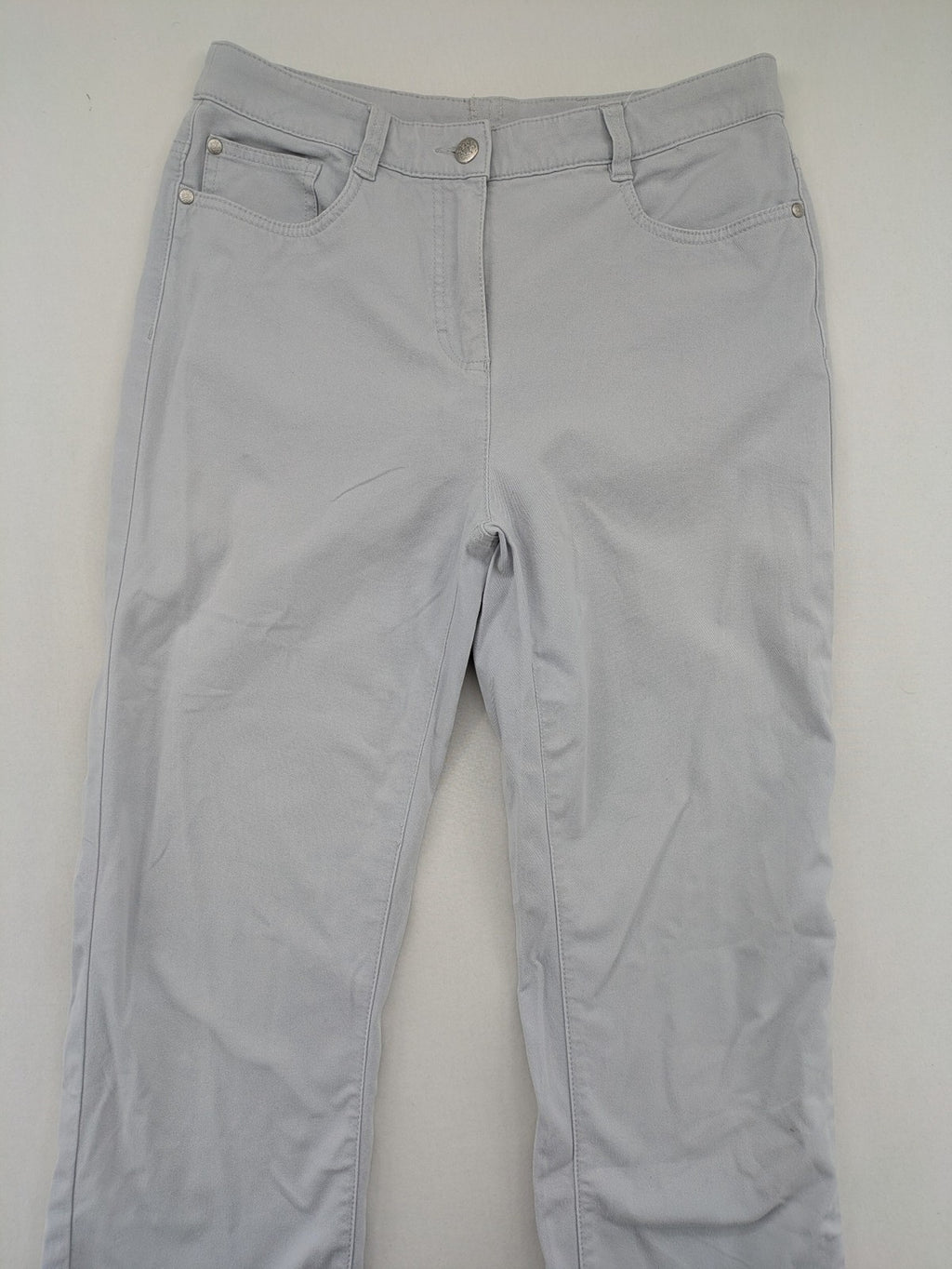 Chino grey capri pants five-pocket design with subtle embroidery and stretch cotton blend.