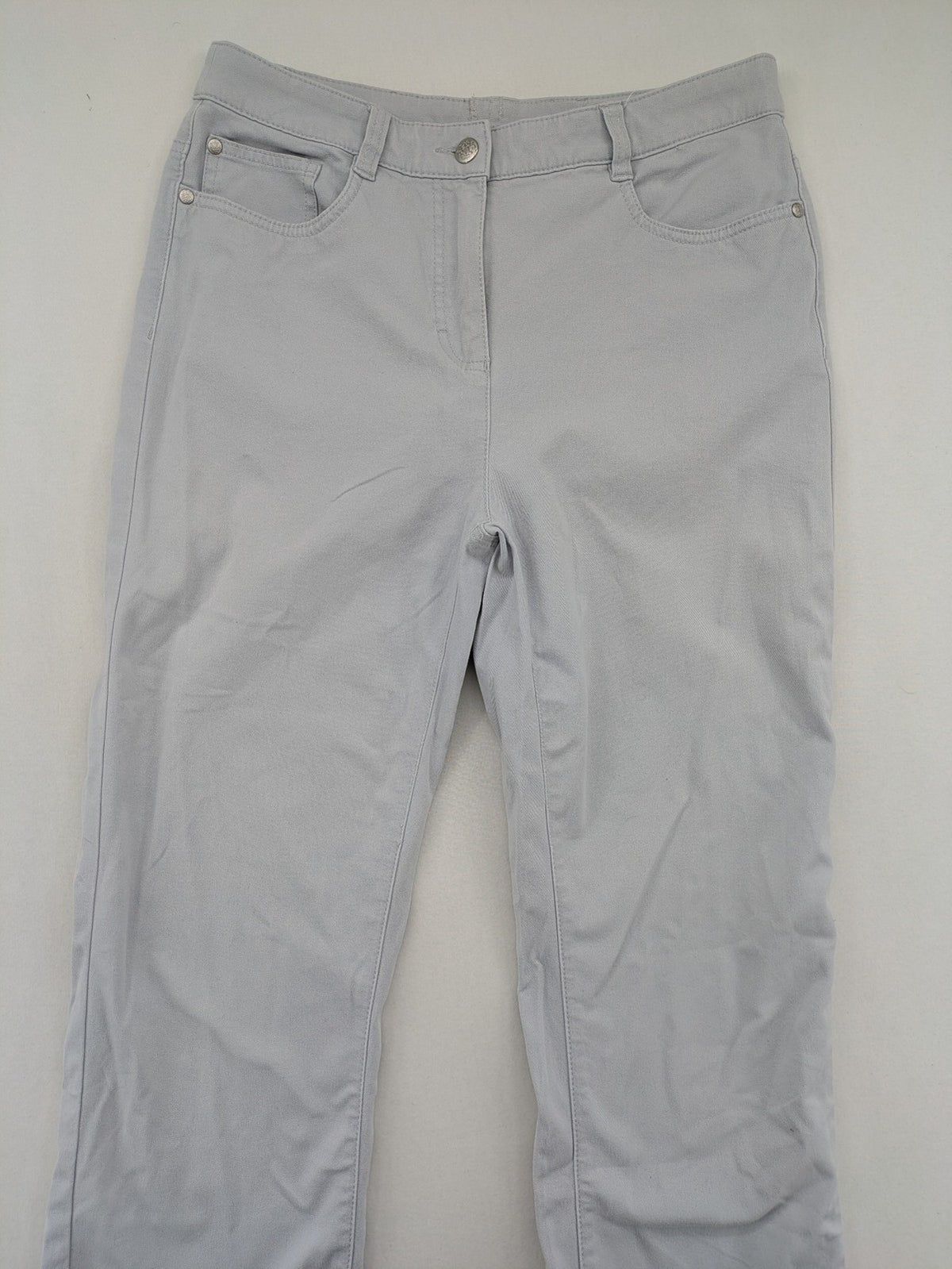 Chino grey capri pants five-pocket design with subtle embroidery and stretch cotton blend.