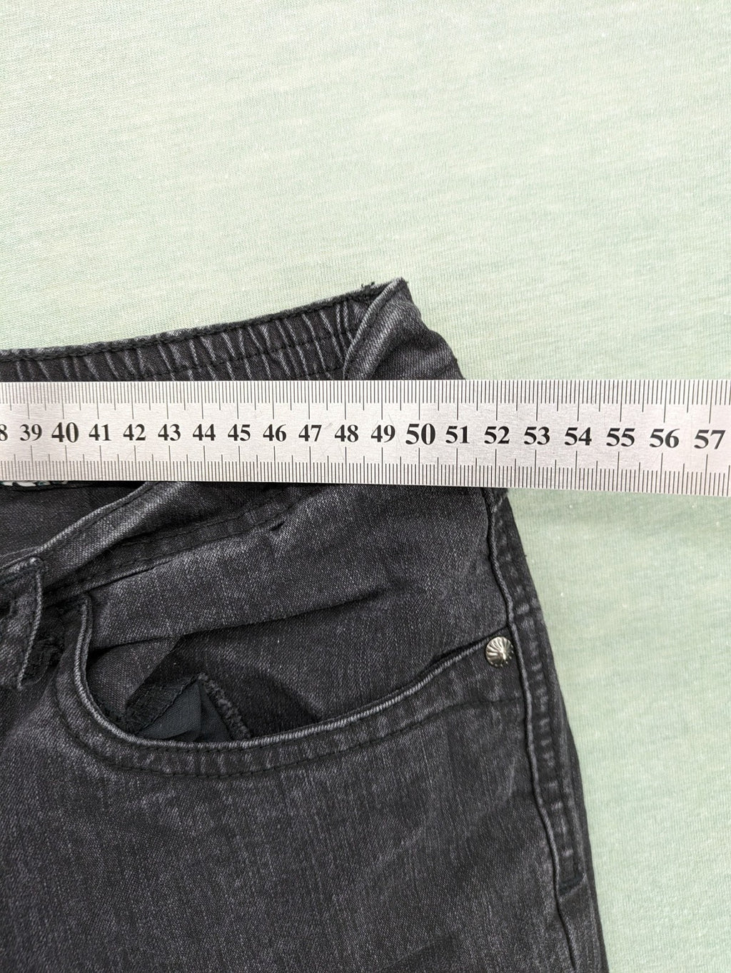 Charles Vögele grey straight jeans with elastic waistband and decorative studs on pockets.