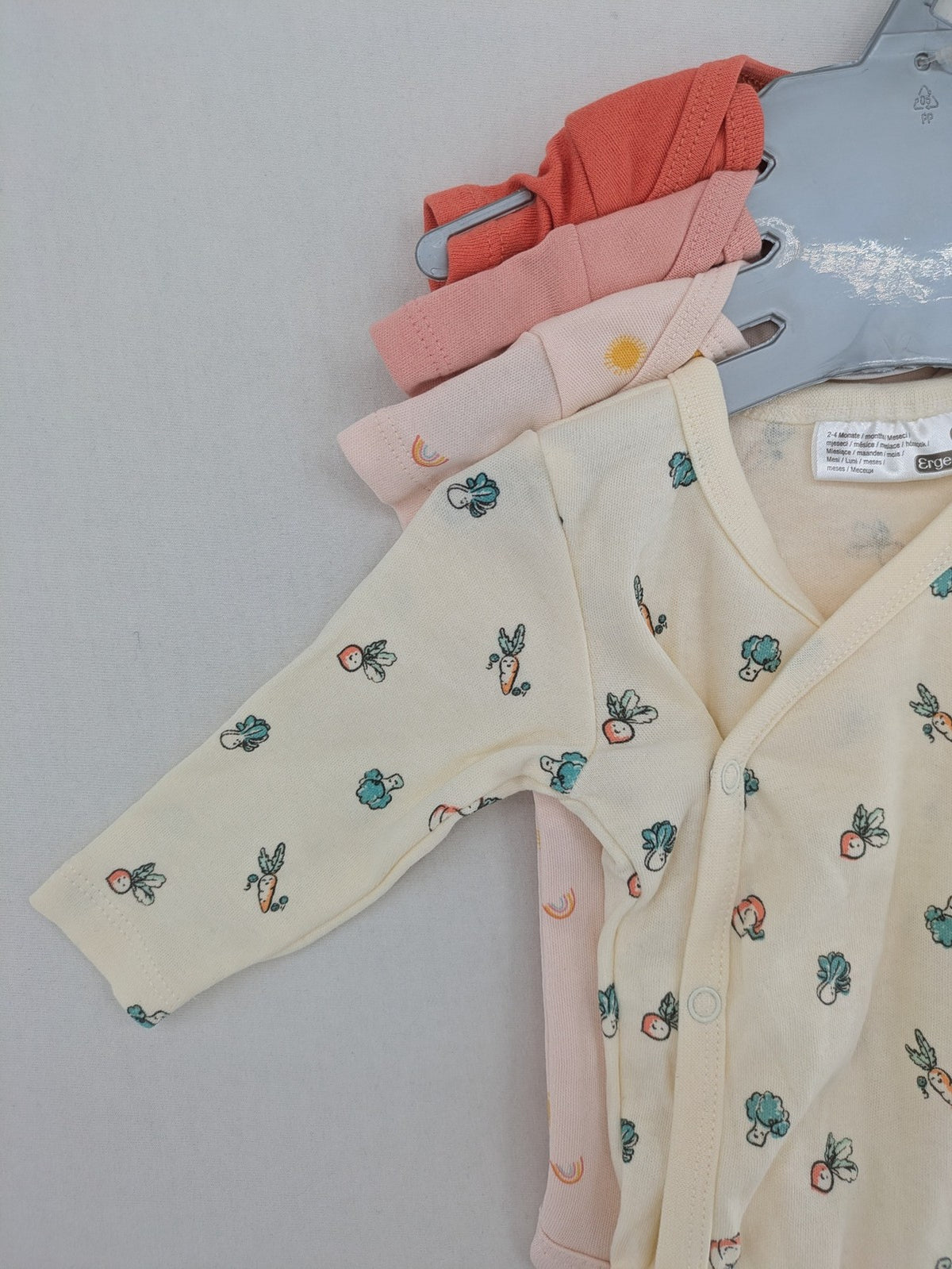 Ergee baby bodysuits set blue cream orange various cute patterns and wrap design.