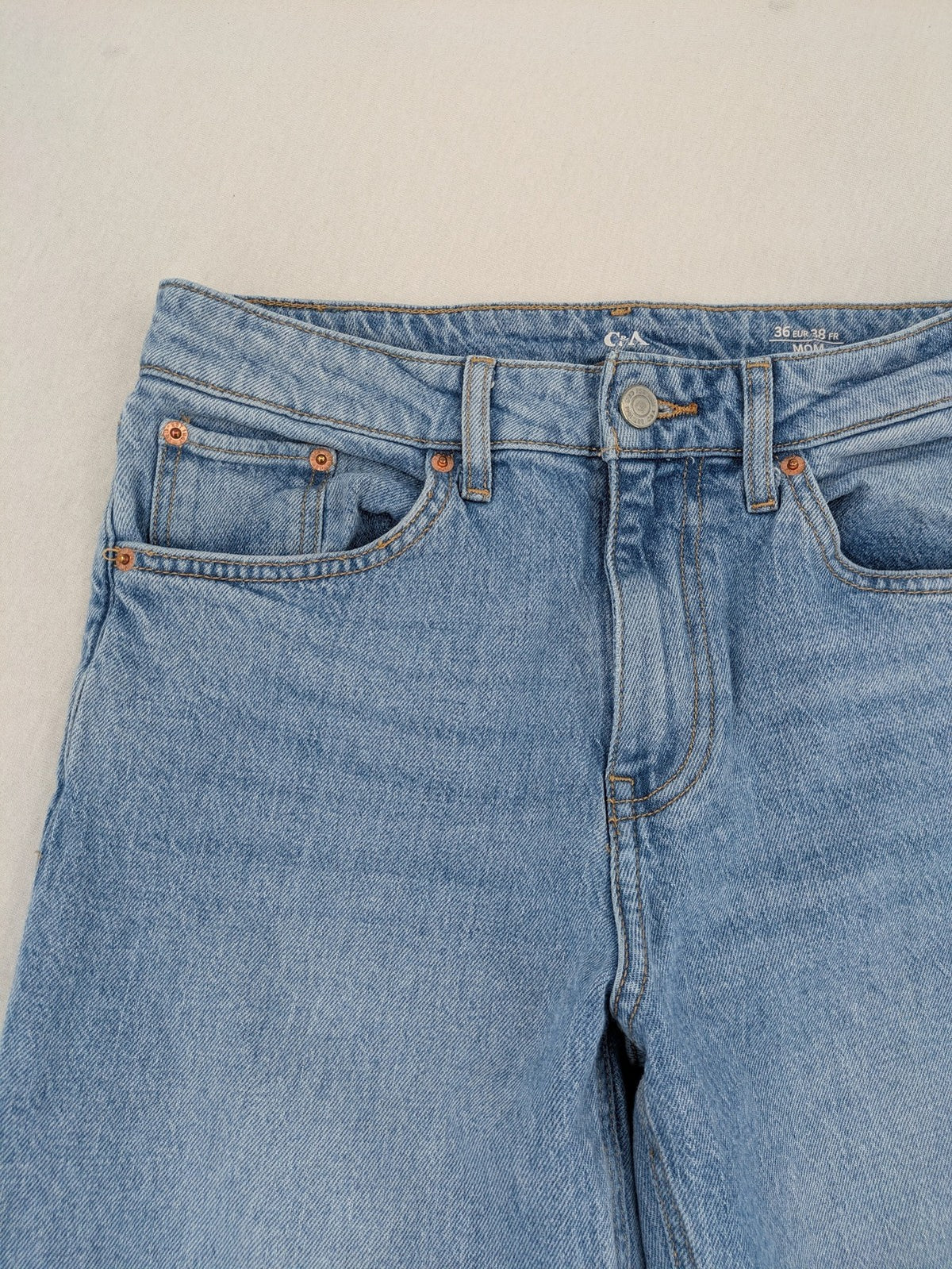 C&A blue mom jeans high waist with unique patchwork design and soft stretch denim.