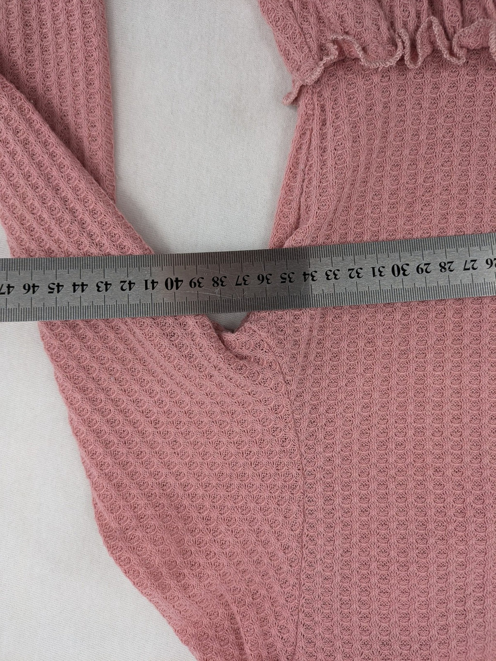 SHEIN pink top V-neck with ruffled waist and three decorative buttons, waffle knit fabric.