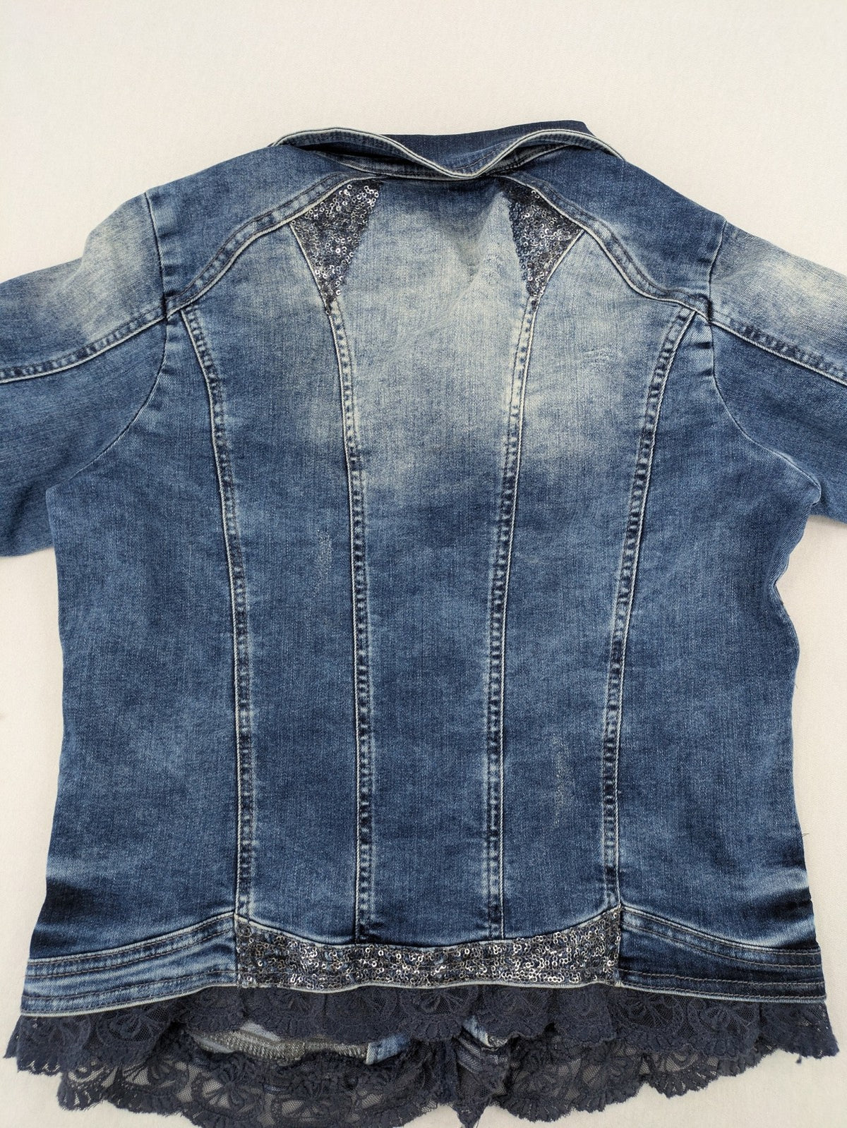 TREDY blue denim jacket with sequins, lace trim, and fitted design.