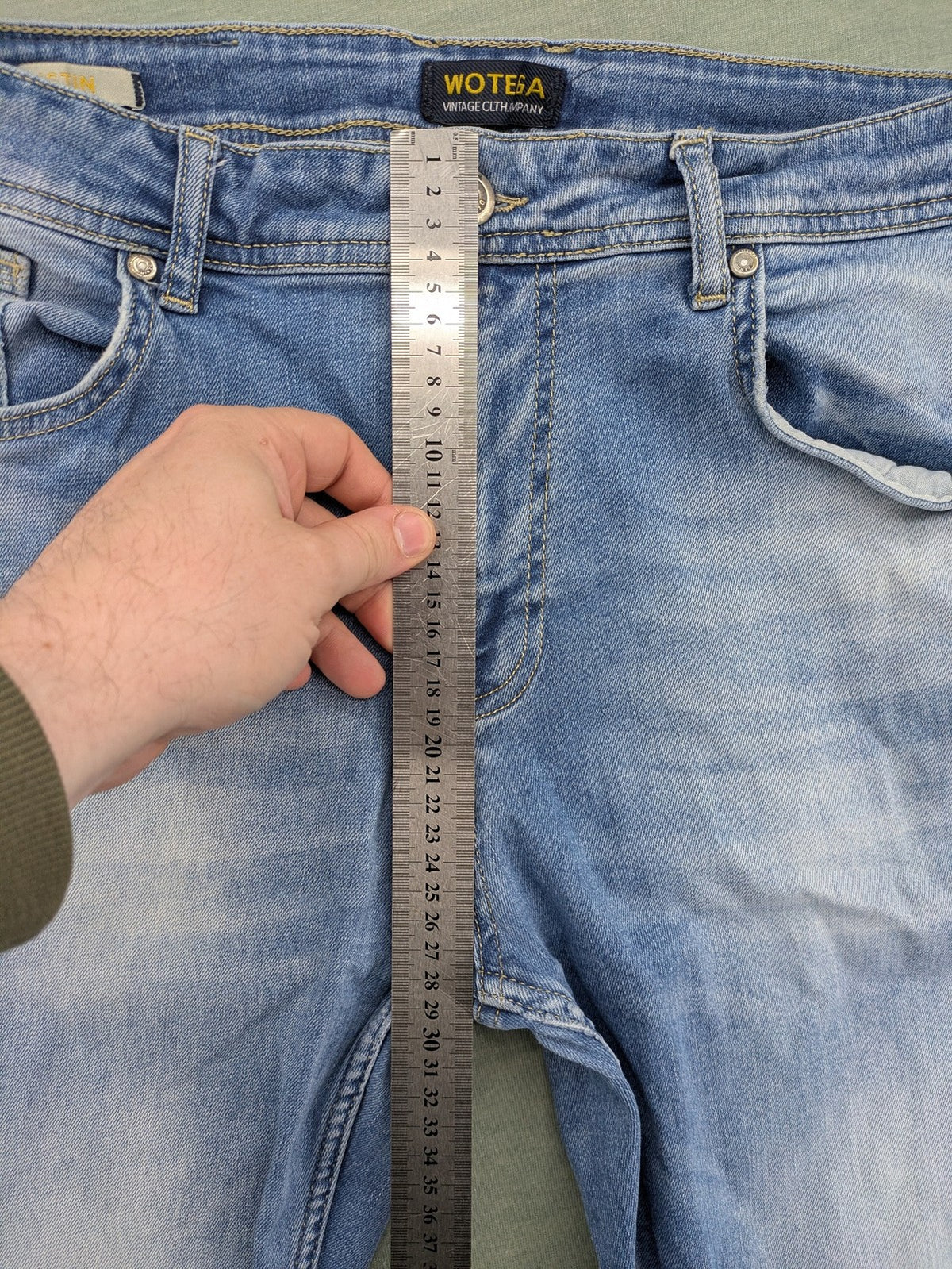 Wotega blue straight jeans light wash faded with classic 5-pocket design and stretch material.