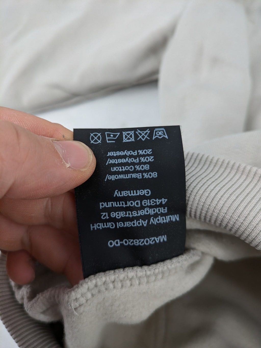 Multiply grey zip-through hoodie with embroidered logo and large "MLTPLY" print on back.