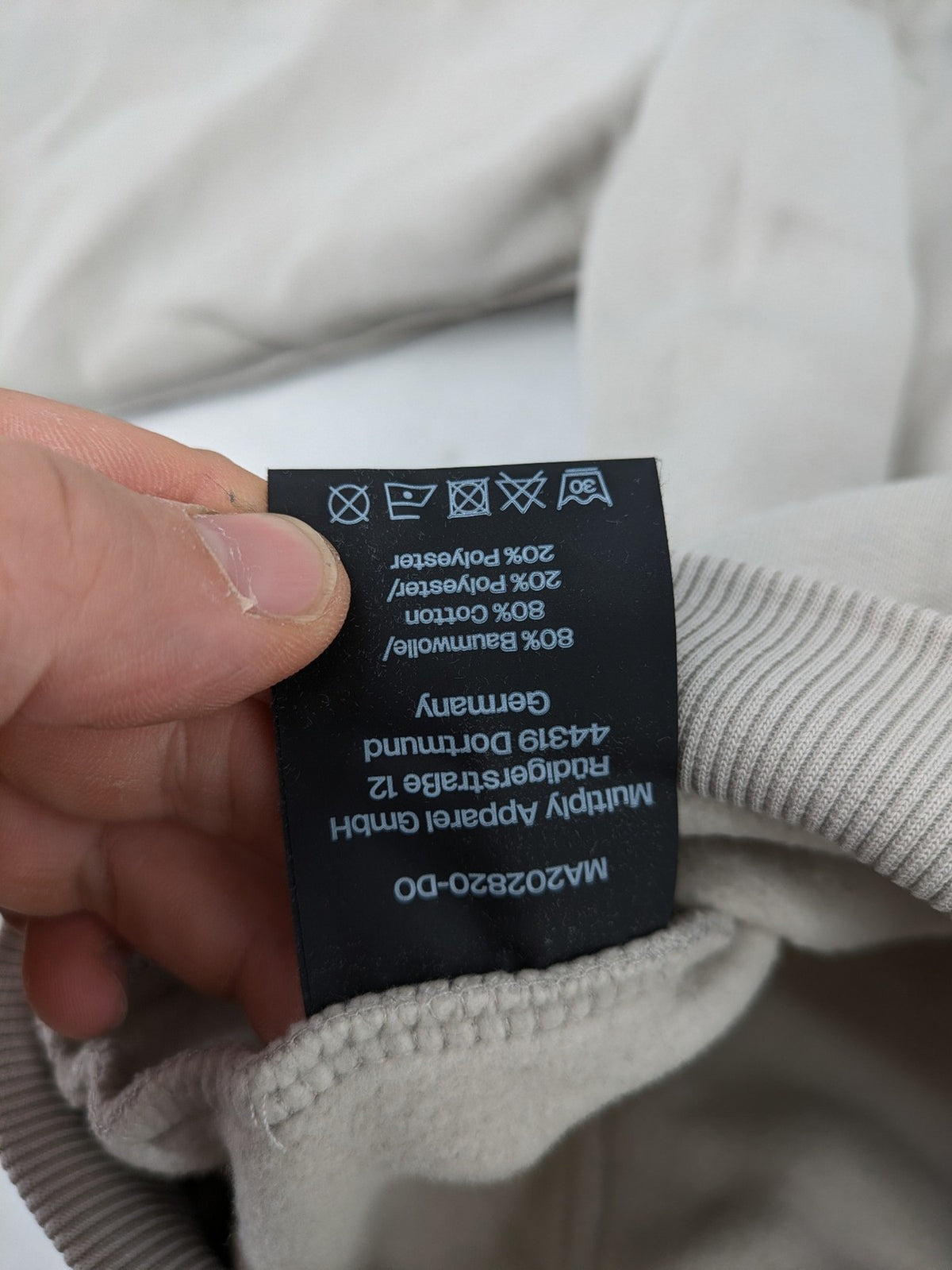 Multiply grey zip-through hoodie with embroidered logo and large "MLTPLY" print on back.
