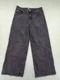 H&M black grey wide leg cropped jeans with frayed hem and high waist design.