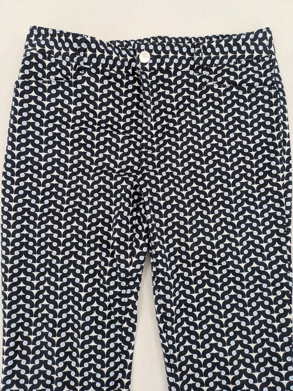 Bonita navy pants with geometric pattern, stretch material, and classic zip fly closure.