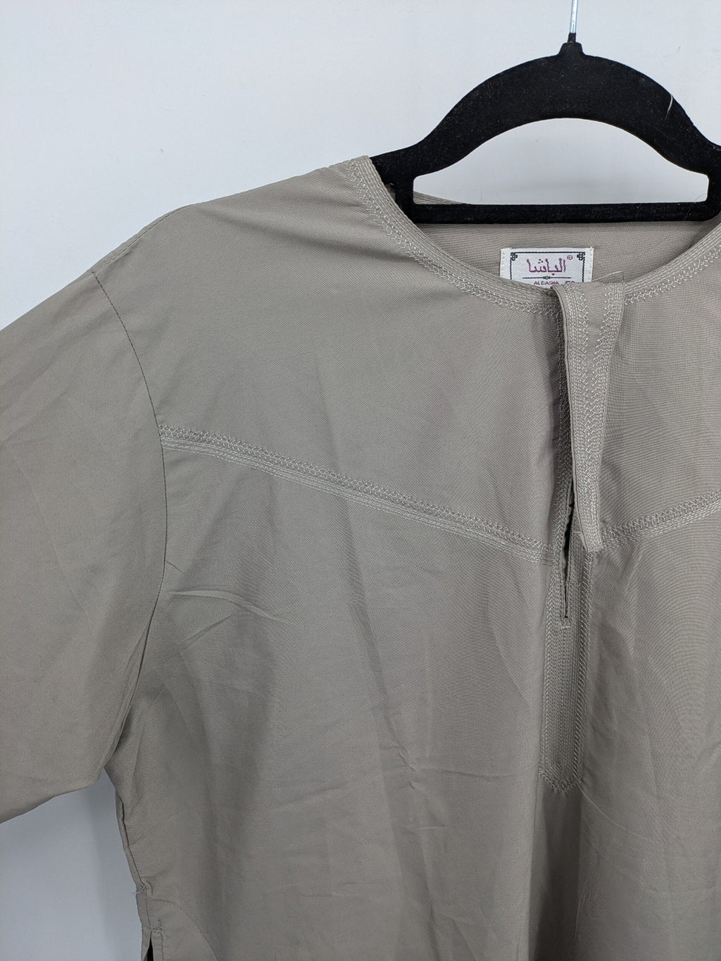 Aleasha beige kaftan thobe long sleeve with subtle embroidery and side pockets.