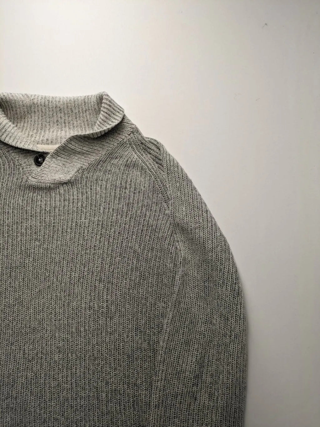 Autumn Glow grey turtle neck jumper with ribbed pattern and button detail.