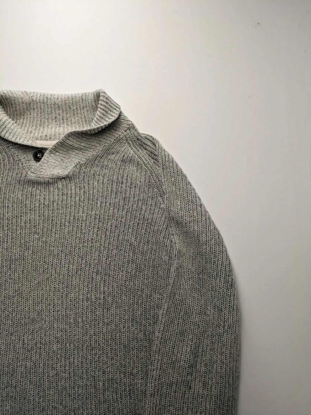 Autumn Glow grey turtle neck jumper with ribbed pattern and button detail.