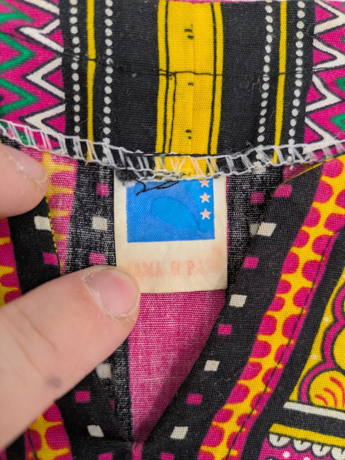 M/L multi Dashiki shirt with vibrant ethnic print on light blue cotton fabric.