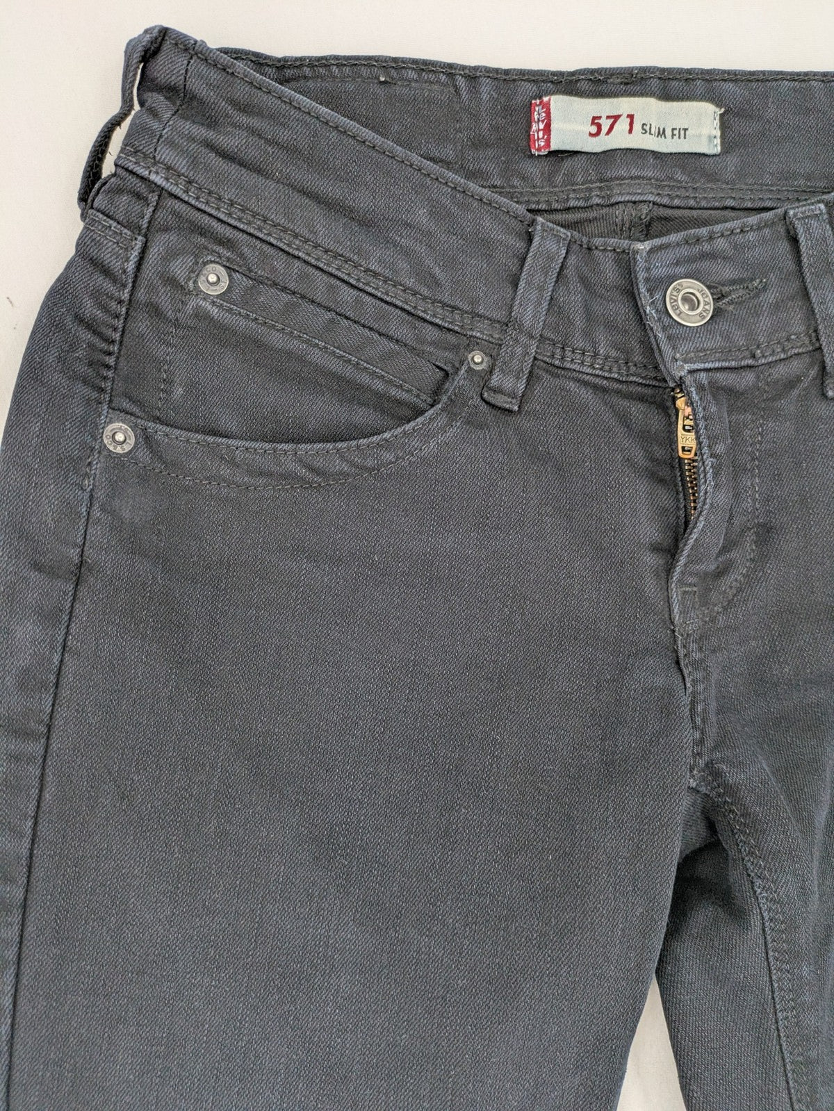Levi's black slim fit jeans with classic 5-pocket design and zipper fly.