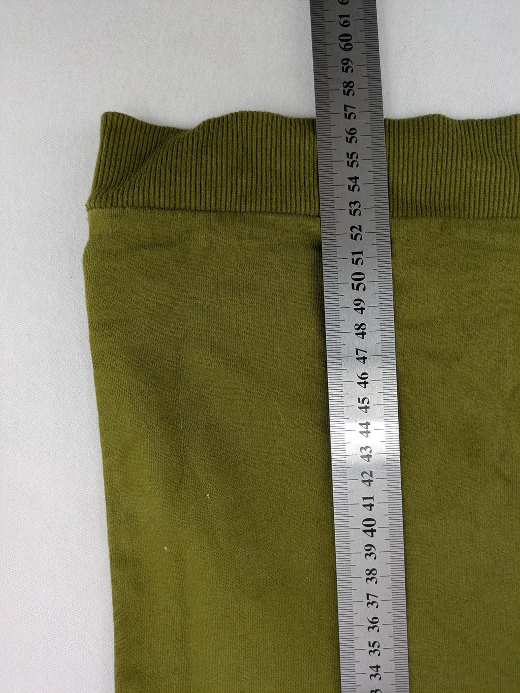 Fortnite green camo hoodie with black logo, contrasting hood, and logo taping on sleeves.