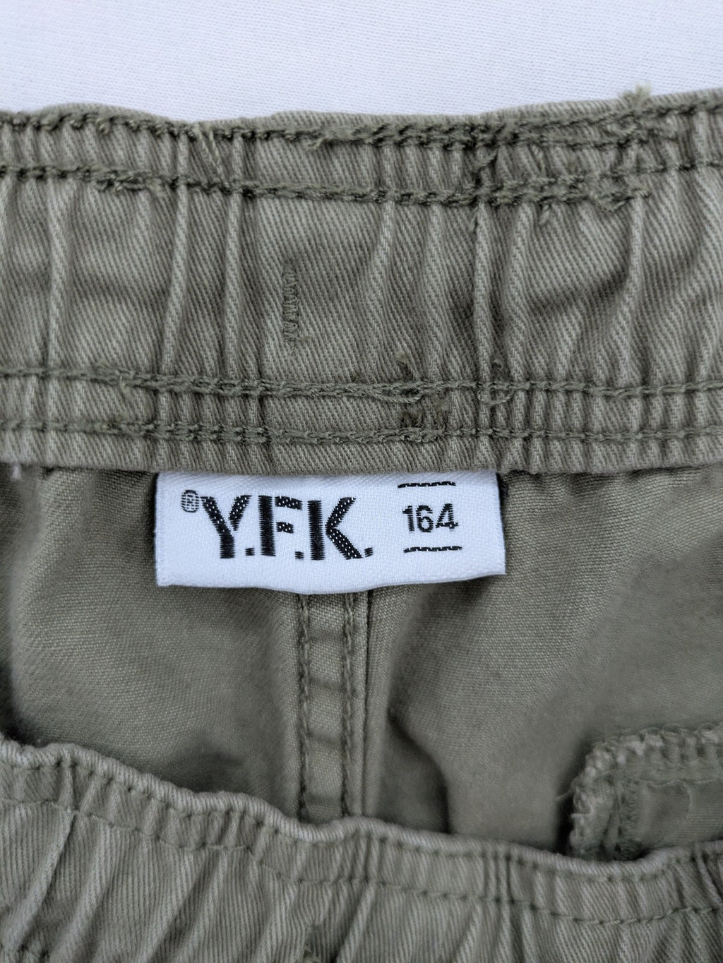 Y.F.K. khaki cargo pants with elastic cuffs, side pockets, and drawstring waistband.