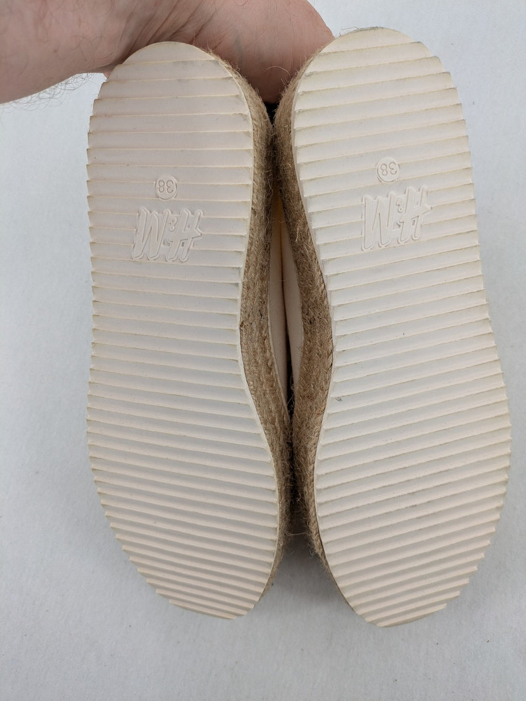 H&M beige espadrille sneakers with jute sole and cream canvas upper.