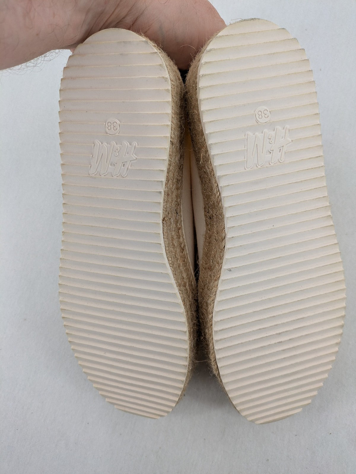 H&M beige espadrille sneakers with jute sole and cream canvas upper.