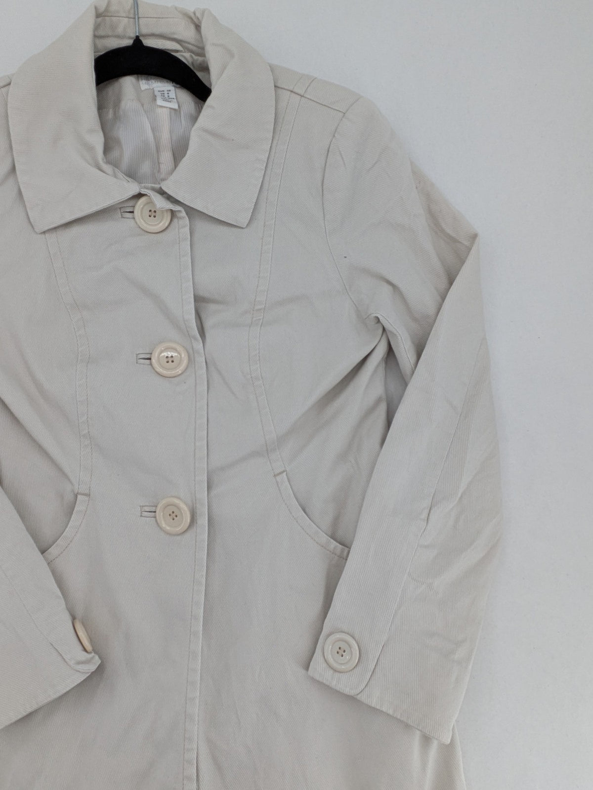 H&M beige trench coat size 38, classic design with button closure and striped lining.